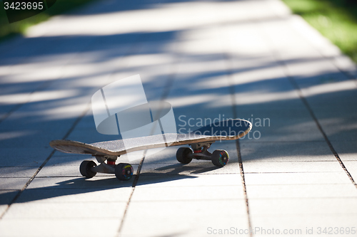 Image of Old used skateboard on street