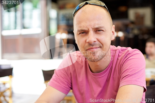 Image of portrait of young man on coffee break