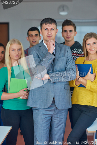 Image of group portrait of teacher with students