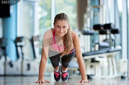 Image of warming up and doing some push ups a the gym