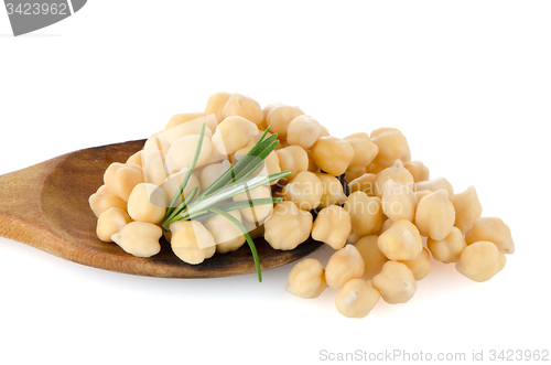 Image of Chickpeas over wooden spoon