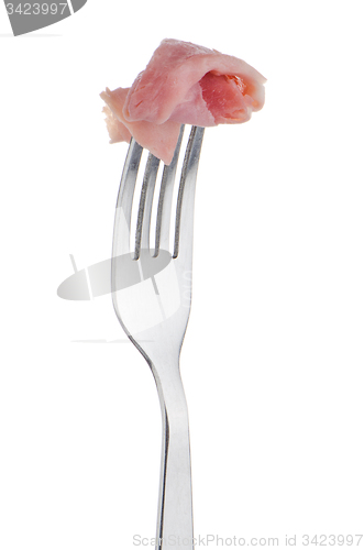 Image of Slice of ham skewered on a fork 