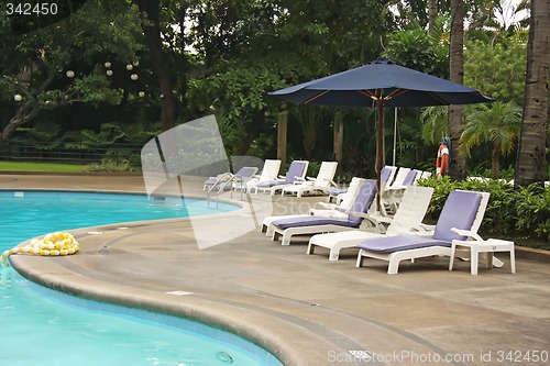Image of Poolside deck chairs