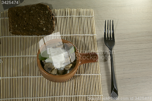 Image of Mushroom stew in a traditional clay bowl