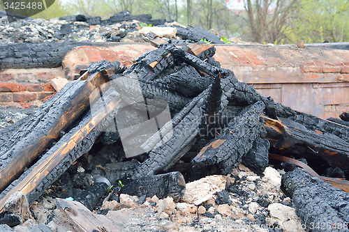 Image of burn ashes on the place of the house