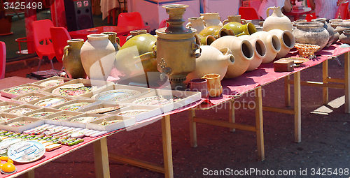 Image of Clay plates, pots and samovars for sale