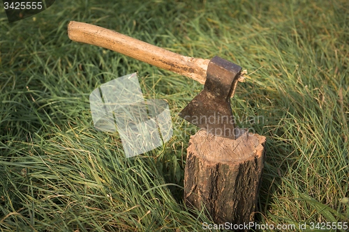 Image of Firewood and old axe