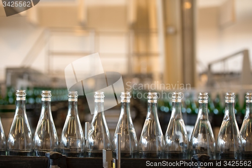 Image of Many bottles on conveyor belt
