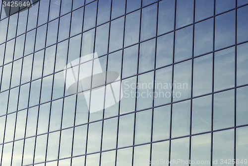 Image of dirty glass windows of an office building