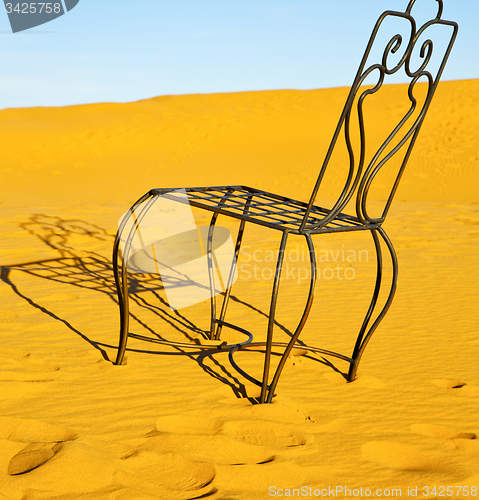 Image of table and seat in desert  sahara morocco    africa yellow sand