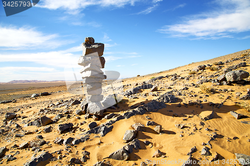 Image of  old fossil in  the  of morocco sahara and rock  stone sky