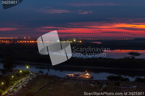 Image of Evening Embankment. People waiting for show