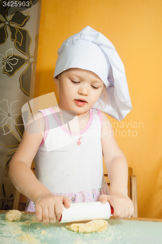 Image of baby girl in cook role