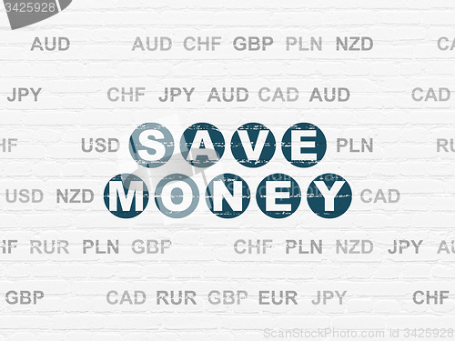 Image of Currency concept: Save Money on wall background