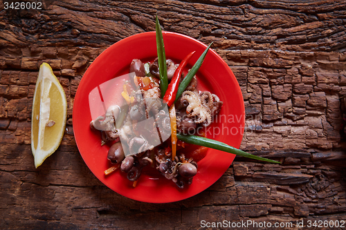 Image of Baby octopuses in red dish