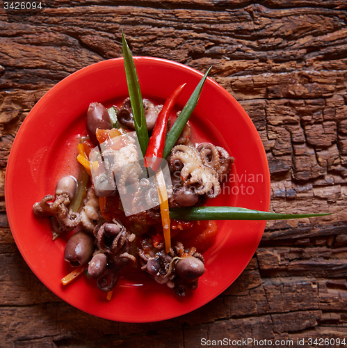 Image of Baby octopuses in red dish