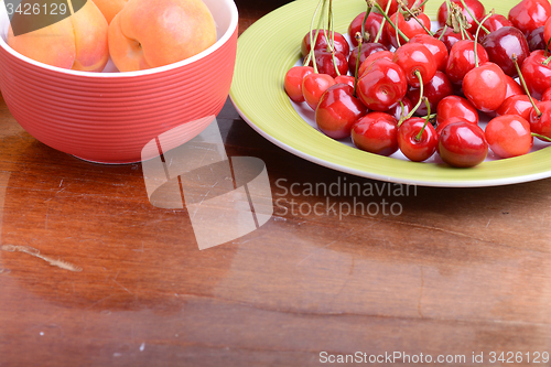 Image of Fresh berries background: apricots, cherries, raspberry, strawberry
