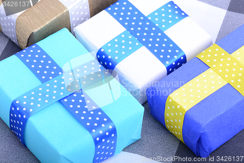 Image of bright gifts with ribbons, holiday invitation card