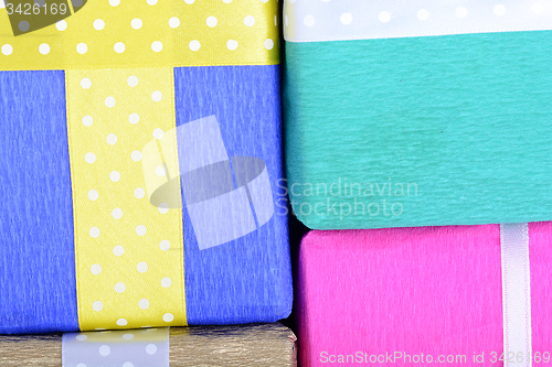 Image of bright gifts with ribbons, holiday invitation card