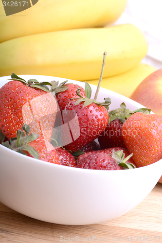 Image of composition of banana and strawberry close up