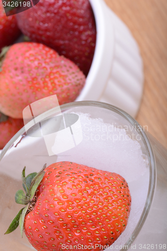 Image of strawberry frozen in ice cube, health food concept