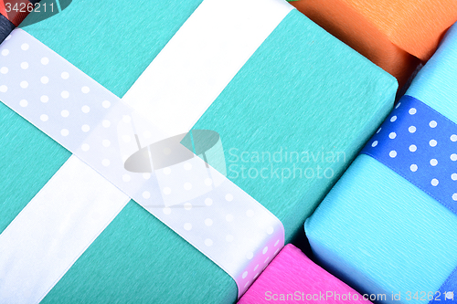 Image of bright gifts with ribbons, holiday invitation card
