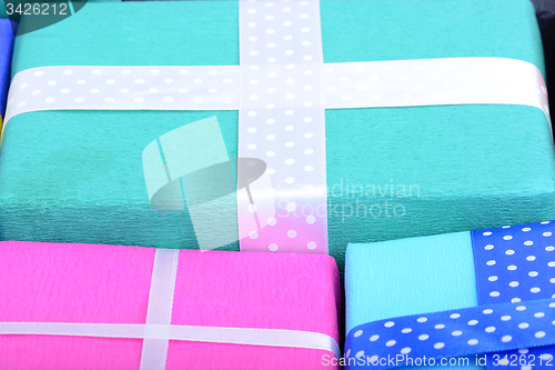 Image of bright gifts with ribbons, holiday invitation card