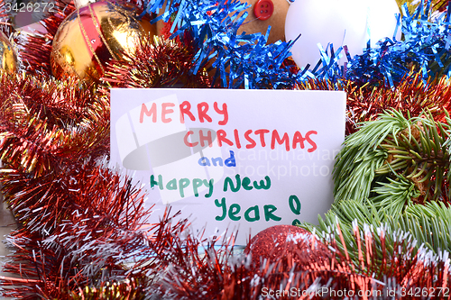 Image of Christmas composition with gift box and decorations, hand drawn watercolor invitation - happy new year and merry christmas