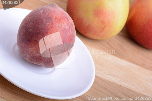 Image of fruits on wodden table, peach, apple, food concept