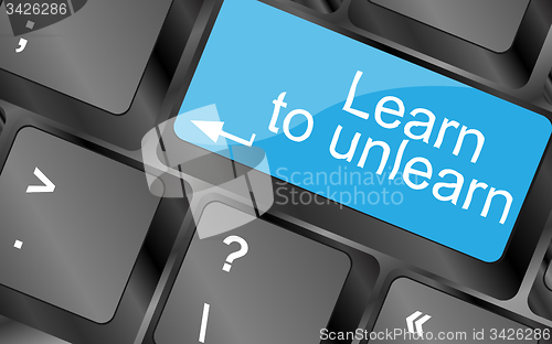 Image of learn to unlearn. Computer keyboard keys with quote button. Inspirational motivational quote. Simple trendy design