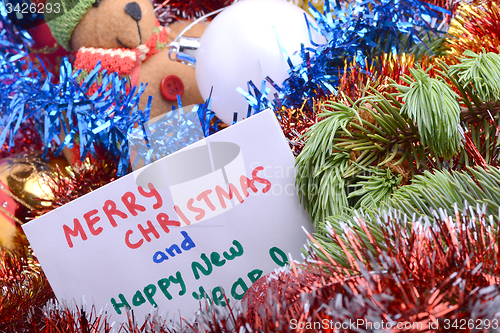 Image of Christmas composition with gift box and decorations, hand drawn watercolor invitation - happy new year and merry christmas