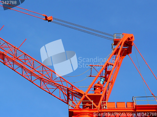 Image of Red crane over blue sky