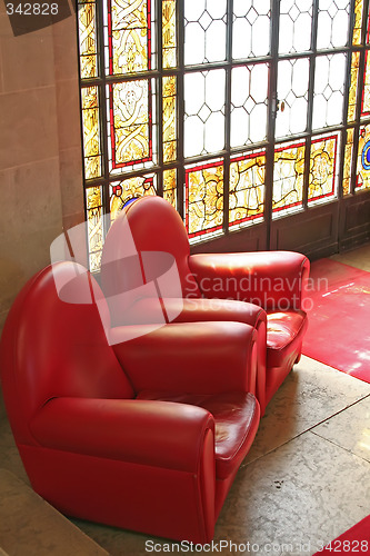 Image of Sofas in waiting area with stained glass window