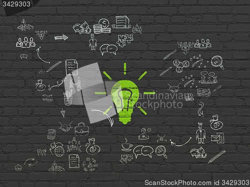 Image of Finance concept: Light Bulb on wall background