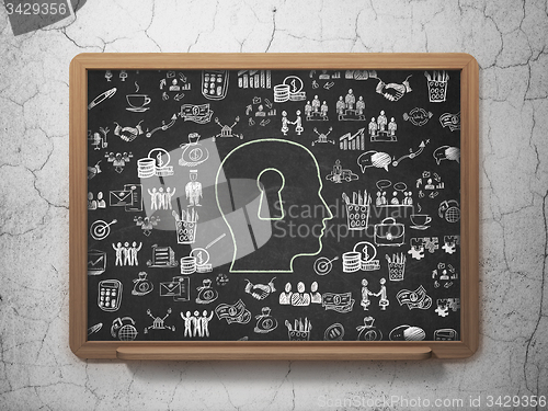Image of Finance concept: Head With Keyhole on School Board background
