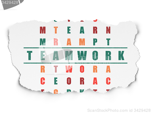 Image of Finance concept: word Teamwork in solving Crossword Puzzle
