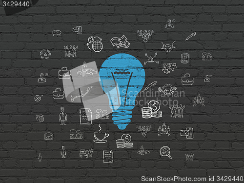 Image of Finance concept: Light Bulb on wall background