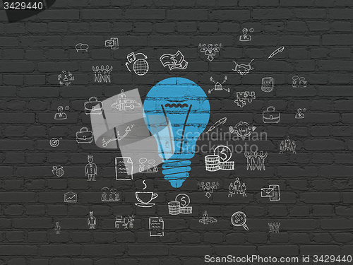 Image of Finance concept: Light Bulb on wall background