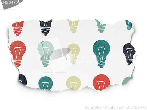 Image of Finance concept: Light Bulb icons on Torn Paper background