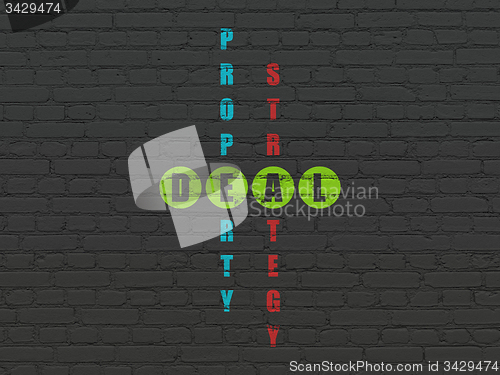 Image of Finance concept: word Deal in solving Crossword Puzzle