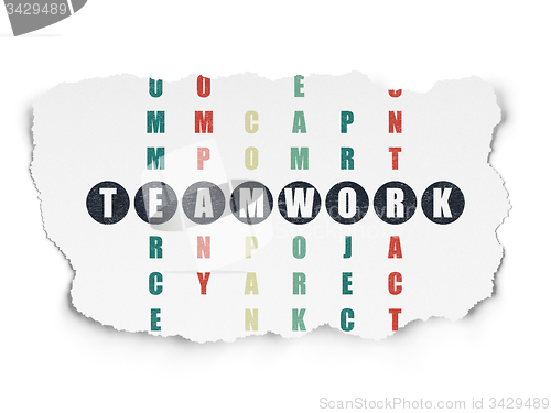 Image of Finance concept: word Teamwork in solving Crossword Puzzle