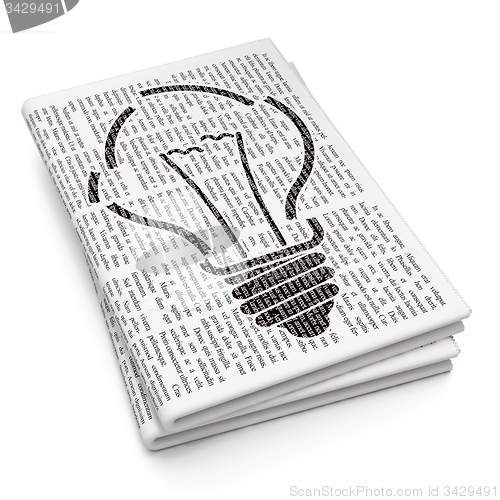 Image of Finance concept: Light Bulb on Newspaper background