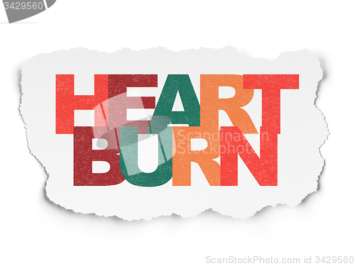 Image of Healthcare concept: Heartburn on Torn Paper background