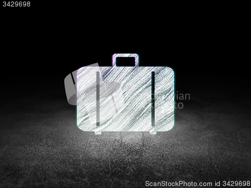 Image of Travel concept: Bag in grunge dark room