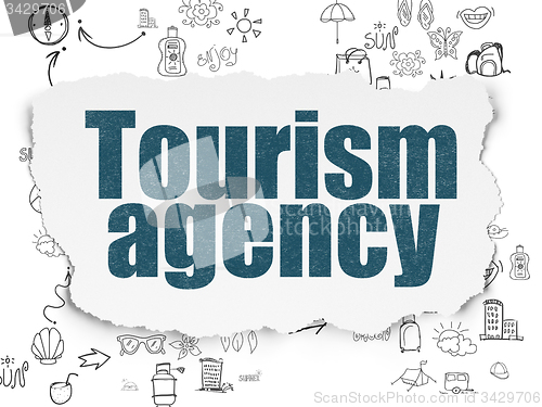 Image of Travel concept: Tourism Agency on Torn Paper background