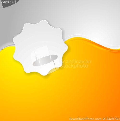 Image of Bright orange waves and white label sticker