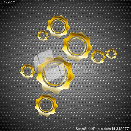Image of Golden gears on perforated metal background