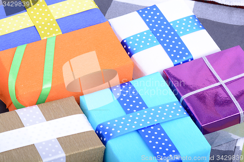 Image of bright gifts with ribbons, holiday invitation card