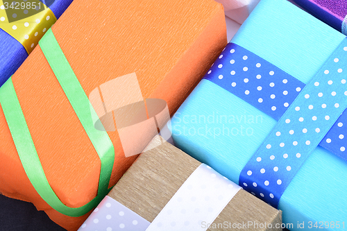 Image of bright gifts with ribbons, holiday invitation card
