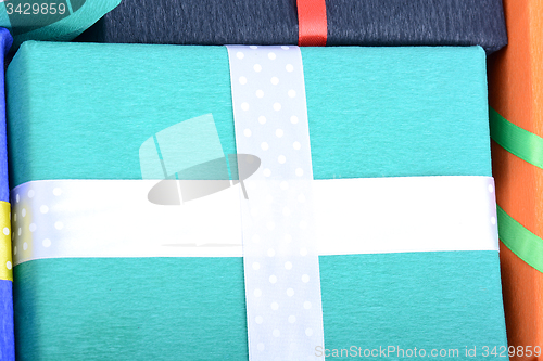 Image of bright gifts with ribbons, holiday invitation card